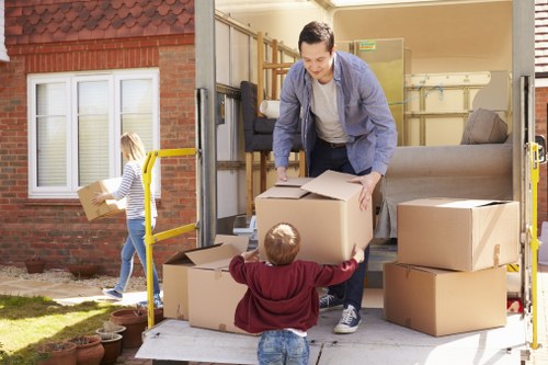 Small moving team handling boxes and furniture in Upper Walthamstow