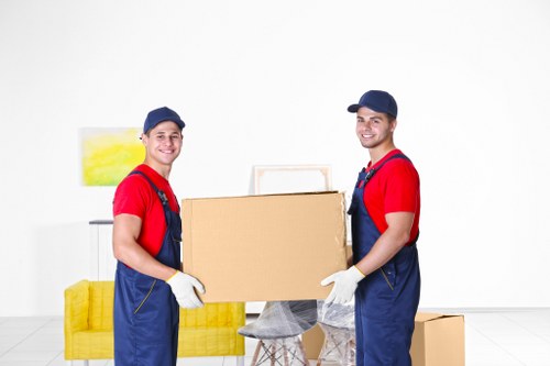 Professional team handling furniture pick-up on a residential street