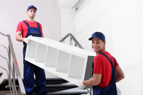 Local man with a van loading furniture near Upper Walthamstow homes