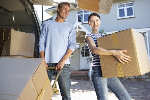 Local office move team handling furniture in Upper Walthamstow streets
