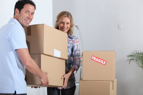 Business moving process with labelled boxes and office furniture setup