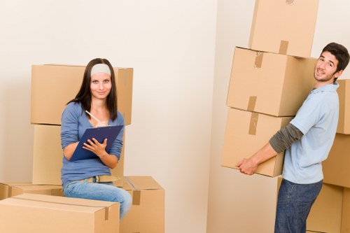 Local moving truck loading household items safely